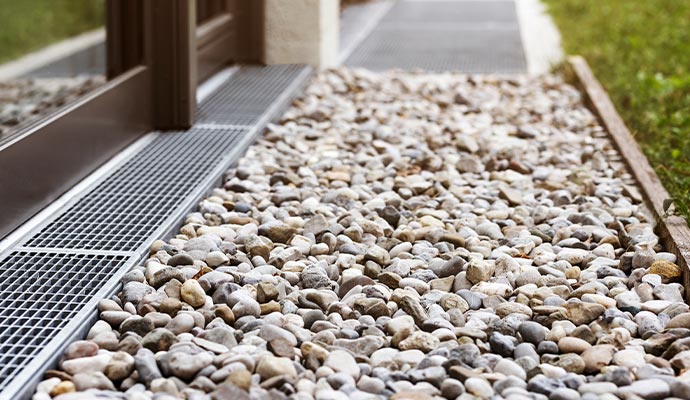Professionally installed entryway drainage system for water management