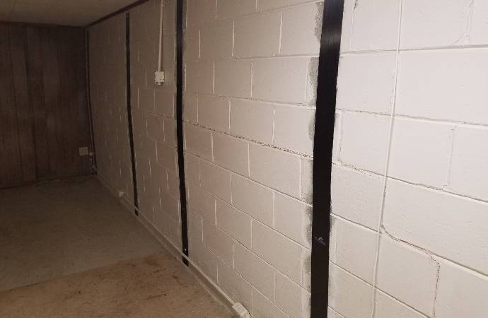 Carbon Fiber Wall Straps for Reinforcing and Repairing Bowing Basement Walls Without Excavation
