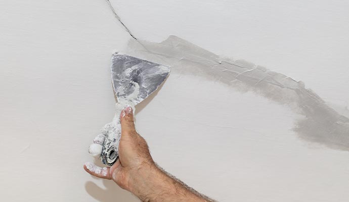 Professional worker repairing foundation