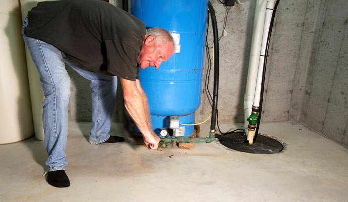 Sump pump maintenance service in progress Sump pump maintenance service in progress