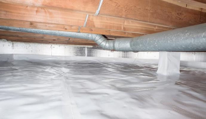 Residential crawl space sealed with vapor barrier