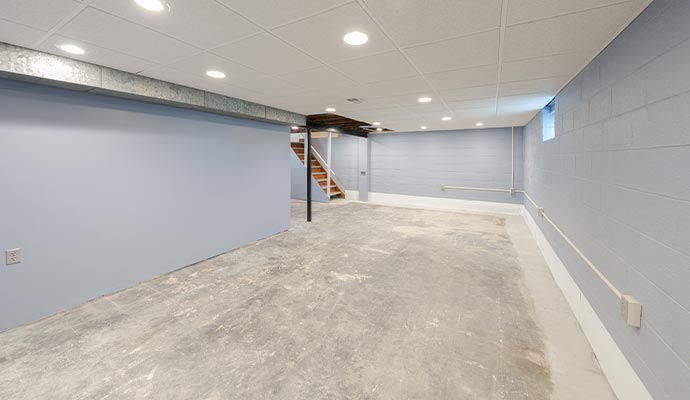 Waterproofed basement with repaired foundation walls and floors