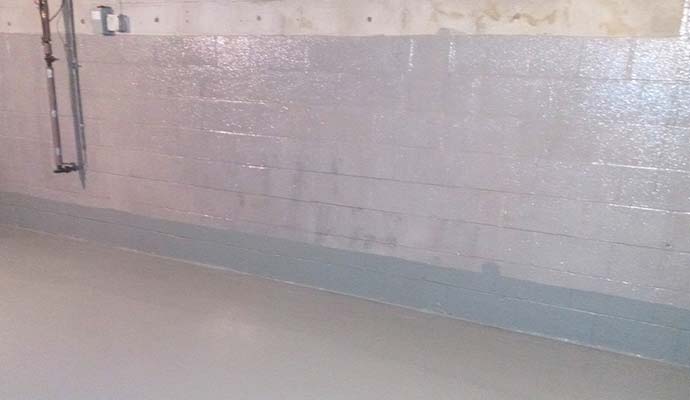 Waterproofed concrete block